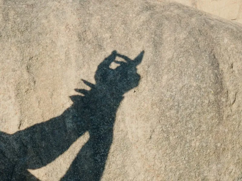 The shadow of hands on warm stone, from Thank You, Summer, an Aesop concept film by Studio Propel