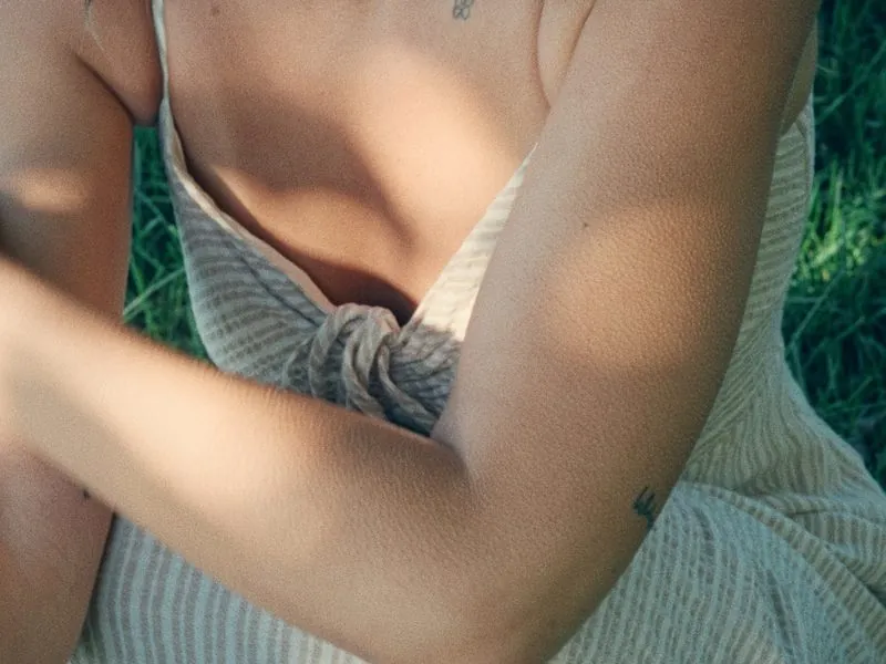 The knot of a linen dress in the afternoon sun, from Thank You, Summer, an Aesop concept film by Studio Propel