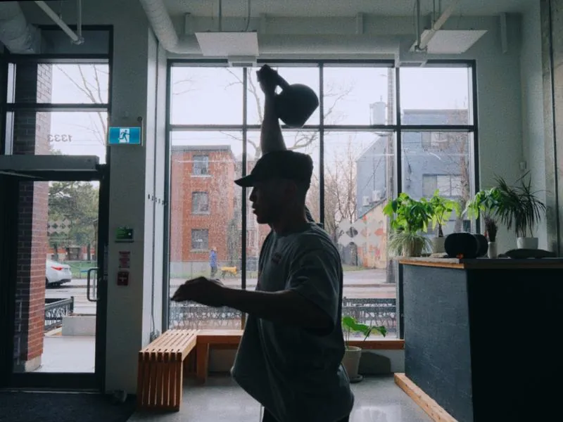 Don Rey Juan training with a kettlebell by the window, from Blank Canvas by Studio Propel