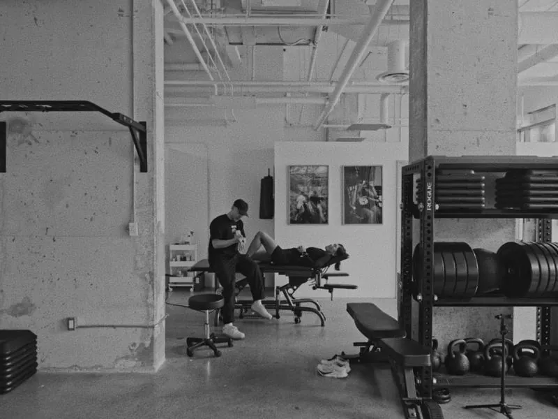 A treatment session in the studio, in black and white, from Blank Canvas by Studio Propel