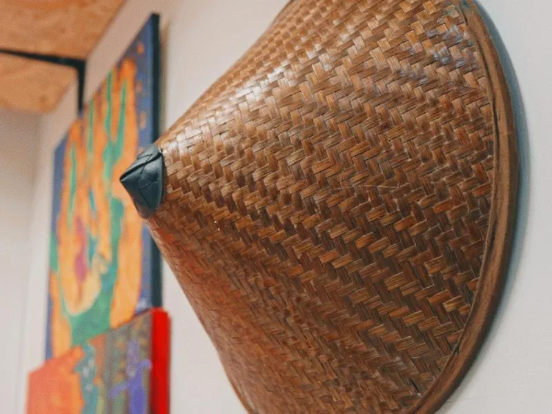 A woven hat on the studio wall, from Imposter Syndrome by Studio Propel