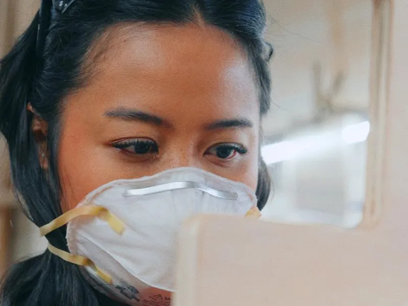 Mar Cortez at work in a dust mask, from Imposter Syndrome by Studio Propel