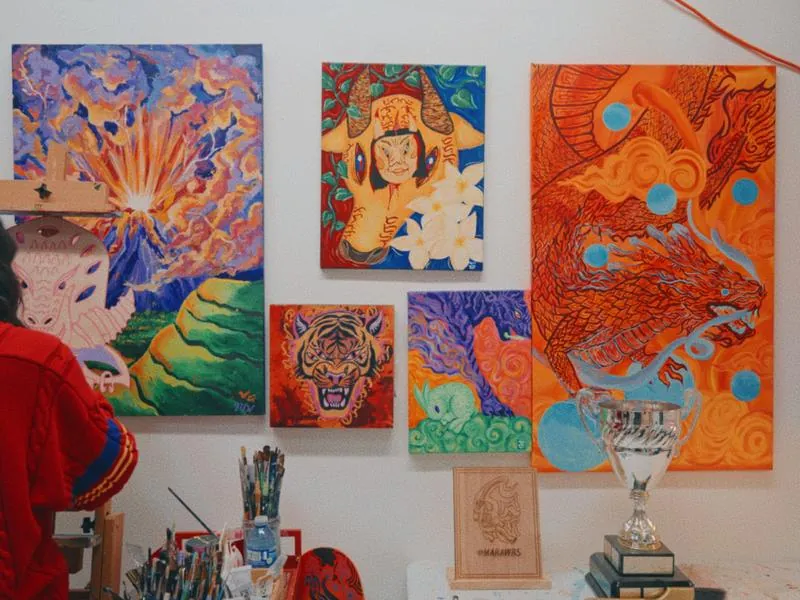 Paintings on the studio wall, from Imposter Syndrome by Studio Propel