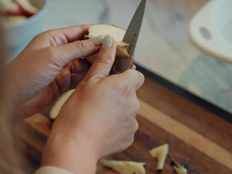 Hands slicing an apple for a school lunch, from First Day, a Studio Propel short film