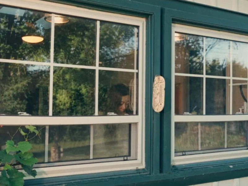 A parent seen through the kitchen window, from First Day, a Studio Propel short film