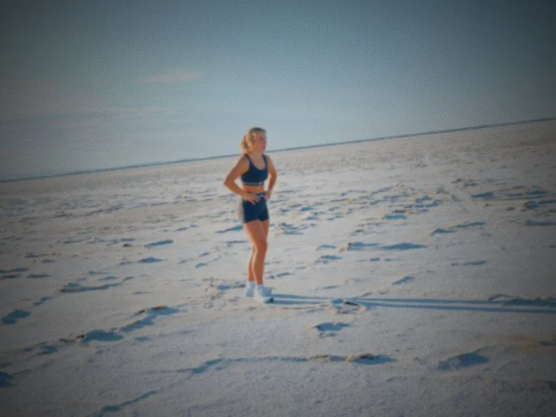 Standing alone on the salt flats, catching her breath, from Infinite Horizon, a New Balance concept film by Studio Propel