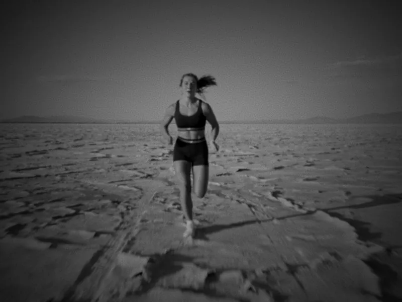 Sprinting straight toward the camera across the salt flats, from Infinite Horizon, a New Balance concept film by Studio Propel