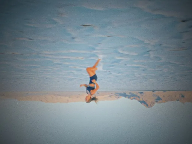 An upside-down frame of a handstand against the mountains, from Infinite Horizon, a New Balance concept film by Studio Propel