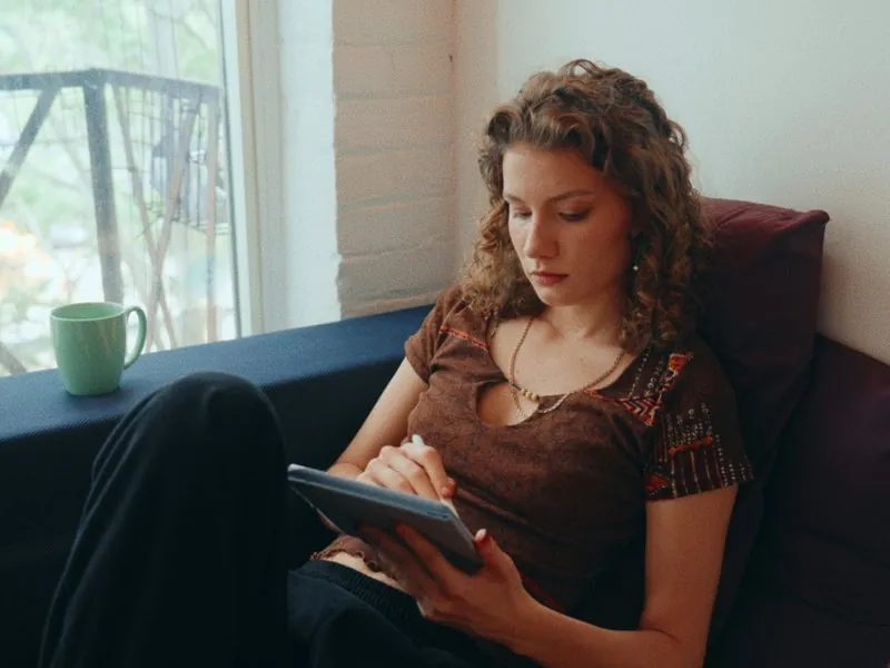 Reading and taking notes by the window, from Curiouser, a Rakuten Kobo concept film by Studio Propel