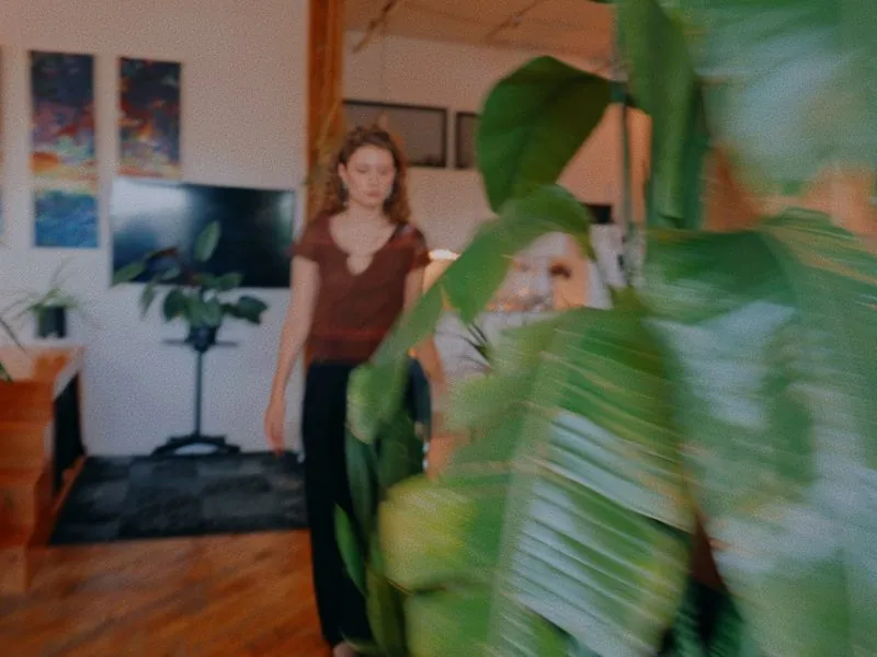 Walking through the loft past the plants, from Curiouser, a Rakuten Kobo concept film by Studio Propel