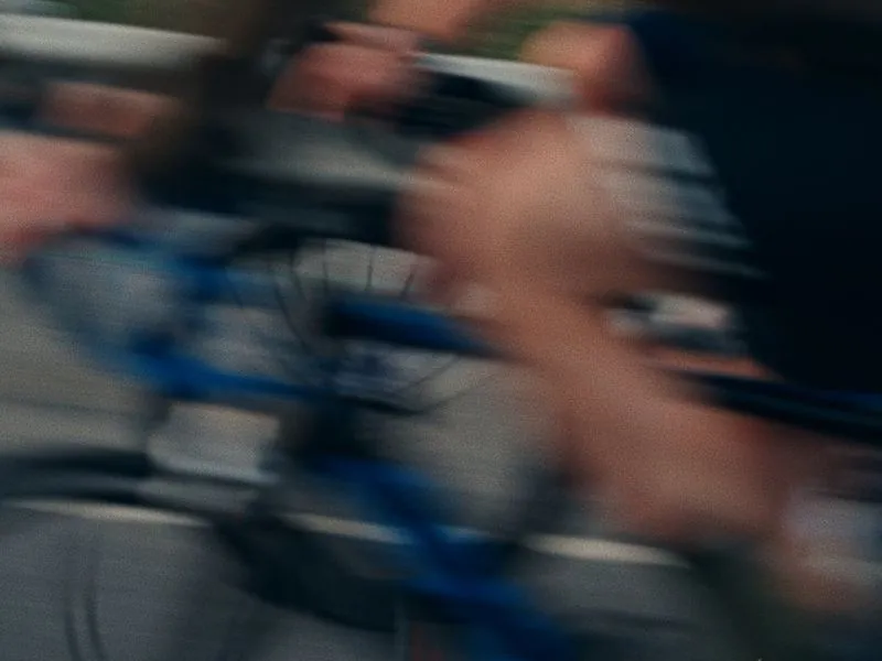 A rider passing in a blur of motion, from Morning Ride, an ÜNDA Movement brand film by Studio Propel