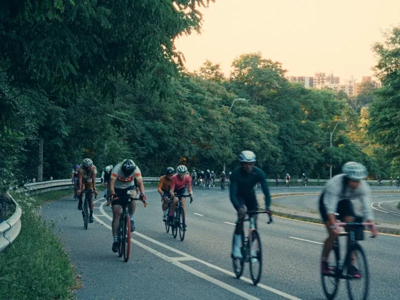 The peloton coming down the hill through the trees, from Morning Ride, an ÜNDA Movement brand film by Studio Propel